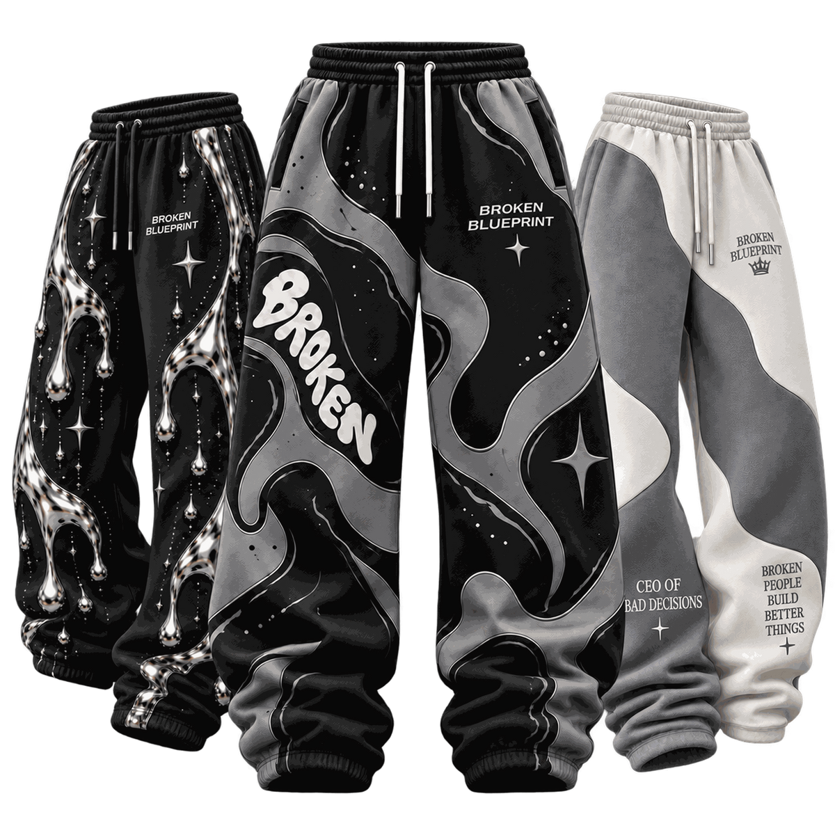 Three Broken Blueprint trackpants: black on the left, black and grey in the centre, and grey and white on the right